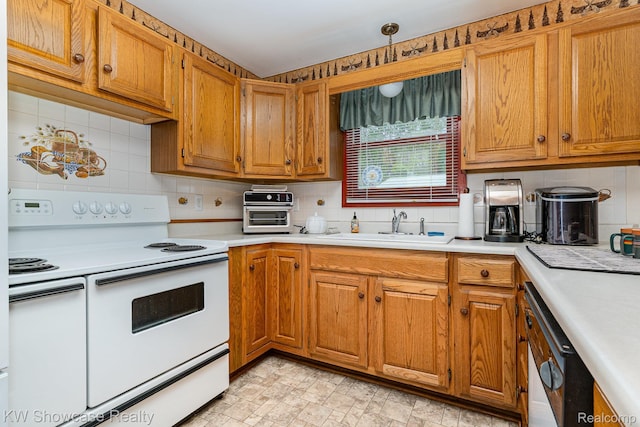 699 W Cherry Creek Rd, Mio, MI 48647 - kitchen with white appliances, light countertops, backsplash, and brown cabinets