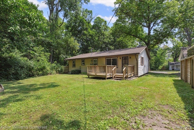 22281 Poinciana St, Southfield, MI 48033 - rear view of property featuring a deck and a yard