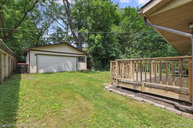 22281 Poinciana St, Southfield, MI 48033 - view of green lawn featuring an outbuilding, a garage, and a deck