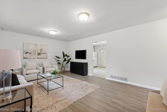 22281 Poinciana St, Southfield, MI 48033 - living room featuring wood finished floors and baseboards