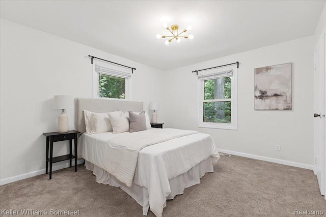 22281 Poinciana St, Southfield, MI 48033 - carpeted bedroom featuring a chandelier and baseboards