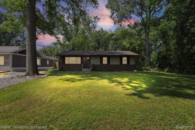 22281 Poinciana St, Southfield, MI 48033 - view of front of house with a front lawn and brick siding