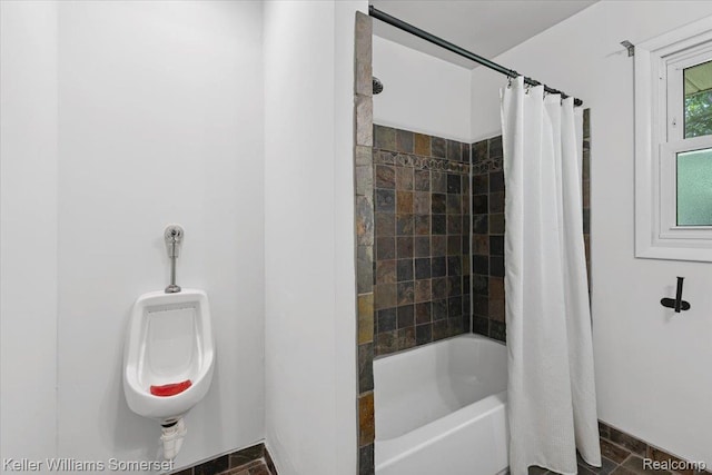 22281 Poinciana St, Southfield, MI 48033 - bathroom with shower / bath combo with shower curtain and baseboards