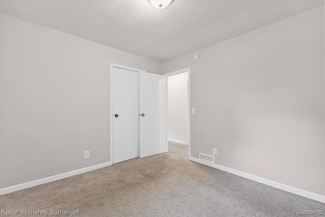 22281 Poinciana St, Southfield, MI 48033 - unfurnished bedroom with carpet floors and baseboards