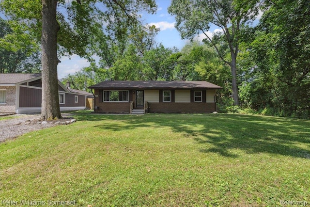 22281 Poinciana St, Southfield, MI 48033 - ranch-style house with brick siding and a front yard