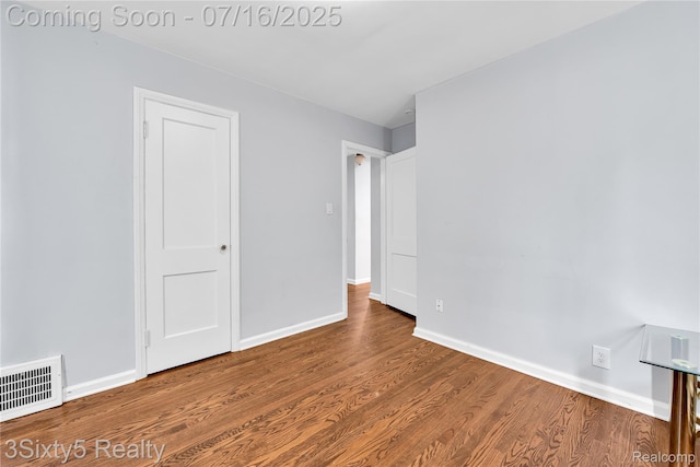 2133 Bailey St, Dearborn, MI 48124 - unfurnished bedroom with wood finished floors and baseboards