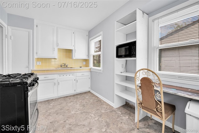 2133 Bailey St, Dearborn, MI 48124 - kitchen with stainless steel range with gas cooktop, white cabinets, black microwave, and open shelves