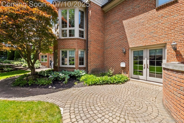 18878 Oak Leaf Ln, Northville, MI 48168 - view of exterior entry featuring french doors and brick siding