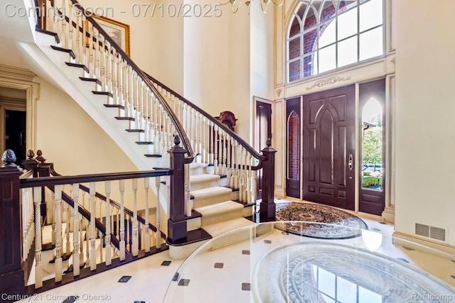 18878 Oak Leaf Ln, Northville, MI 48168 - entrance foyer with a high ceiling, healthy amount of natural light, and stairs