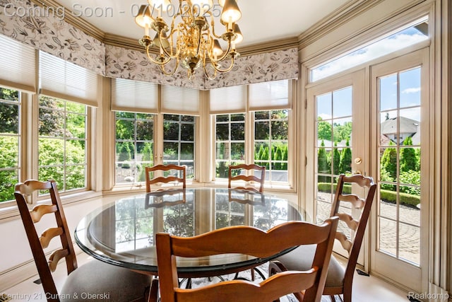 18878 Oak Leaf Ln, Northville, MI 48168 - sunroom / solarium featuring french doors, a chandelier, and ornamental molding