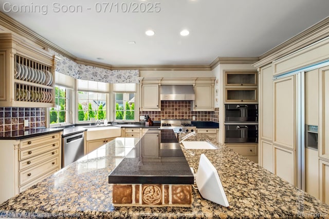 18878 Oak Leaf Ln, Northville, MI 48168 - kitchen with cream cabinetry, dishwasher, ventilation hood, paneled fridge, and a large island