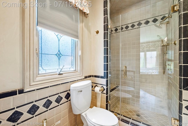 18878 Oak Leaf Ln, Northville, MI 48168 - full bath with a shower stall, plenty of natural light, tile walls, and wainscoting