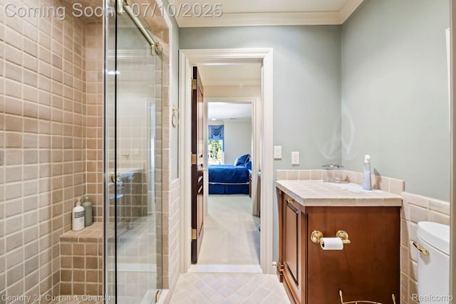 18878 Oak Leaf Ln, Northville, MI 48168 - ensuite bathroom featuring crown molding, vanity, a stall shower, and tile patterned floors