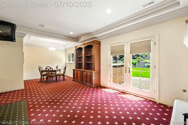 18878 Oak Leaf Ln, Northville, MI 48168 - living area featuring french doors, a raised ceiling, carpet flooring, ornamental molding, and healthy amount of natural light