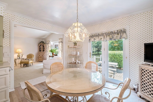 2032 Crestline, Burton, MI 48509 - dining area featuring crown molding, a chandelier, wallpapered walls, and light wood-type flooring
