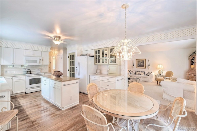 2032 Crestline, Burton, MI 48509 - dining room with light wood-type flooring, a chandelier, crown molding, and a ceiling fan
