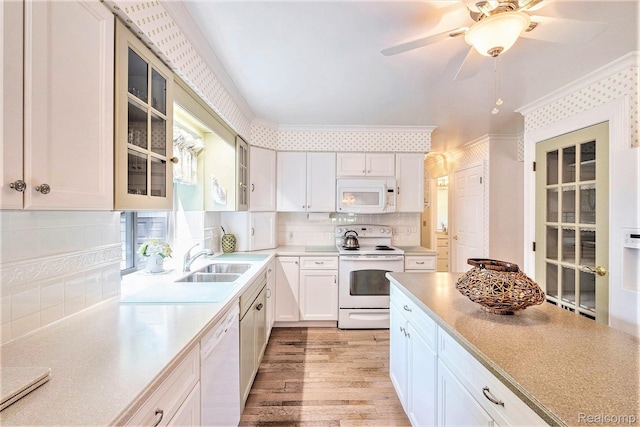2032 Crestline, Burton, MI 48509 - kitchen featuring white appliances, glass insert cabinets, decorative backsplash, light countertops, and white cabinetry