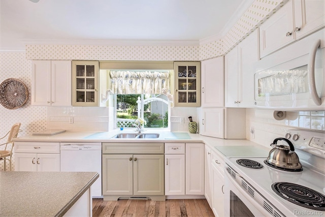 2032 Crestline, Burton, MI 48509 - kitchen with white appliances, crown molding, wallpapered walls, light wood-type flooring, and glass insert cabinets