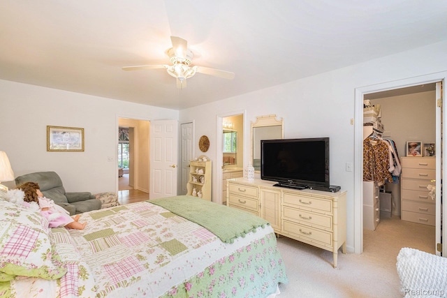 2032 Crestline, Burton, MI 48509 - bedroom featuring a closet, ensuite bathroom, light carpet, a spacious closet, and a ceiling fan