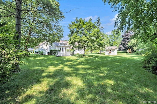 2032 Crestline, Burton, MI 48509 - view of green lawn featuring a gazebo and an outbuilding