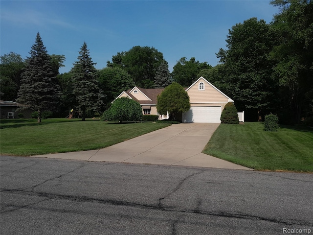 2032 Crestline, Burton, MI 48509 - view of property hidden behind natural elements with a front lawn, concrete driveway, and a garage
