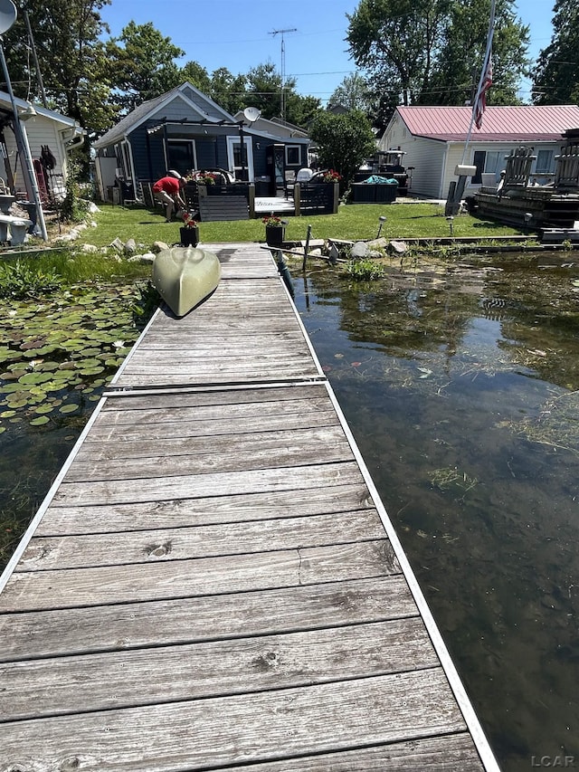 2907 W Ferndale Dr, Manitou Beach, MI 49253 - dock with a yard and a water view