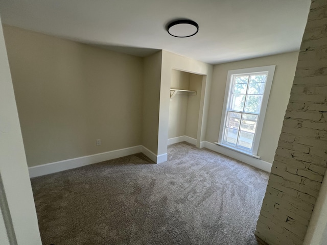 717 Watson St SW, Grand Rapids, MI 49504 - unfurnished bedroom with carpet and a closet