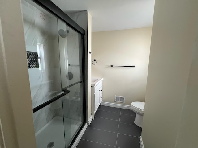 717 Watson St SW, Grand Rapids, MI 49504 - full bath with tile patterned flooring, a stall shower, and vanity
