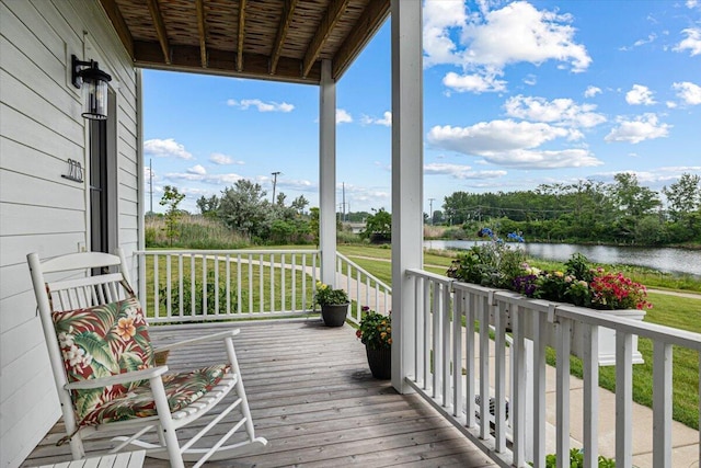 273 Waters Edge Dr, Saint Joseph, MI 49085 - wooden porch with a water view and a yard