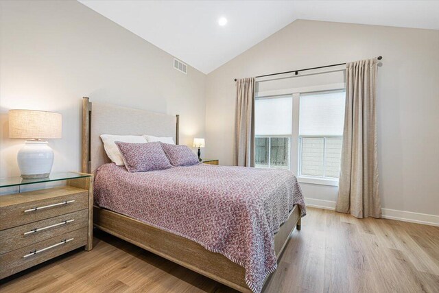 273 Waters Edge Dr, Saint Joseph, MI 49085 - bedroom with wood finished floors, high vaulted ceiling, and recessed lighting
