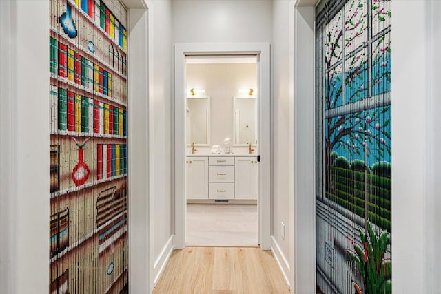 273 Waters Edge Dr, Saint Joseph, MI 49085 - corridor featuring light wood-style flooring and baseboards