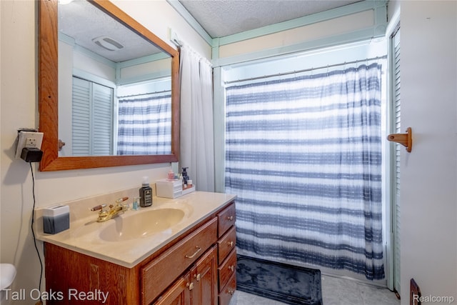 6123 Lapeer Rd, Burton, MI 48509 - bathroom with vanity, a textured ceiling, and tile patterned flooring