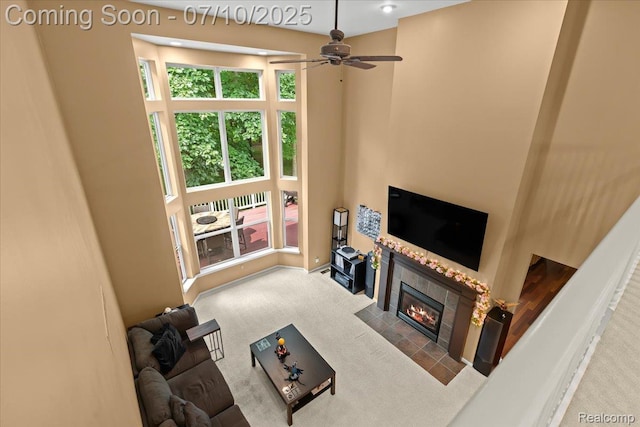 4583 Racewood Dr, Commerce Twp, MI 48382 - living room with carpet, a tile fireplace, and ceiling fan