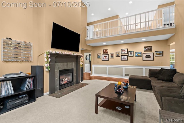 4583 Racewood Dr, Commerce Twp, MI 48382 - living room with a towering ceiling, a tile fireplace, and recessed lighting