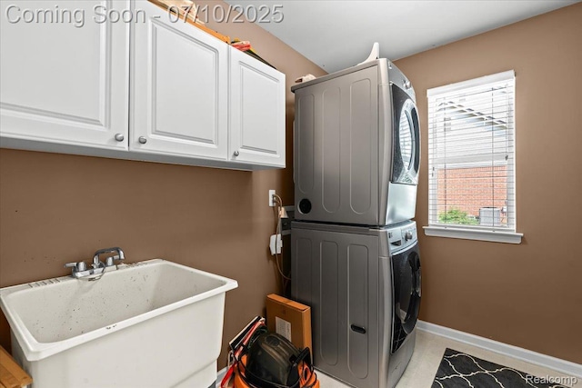 4583 Racewood Dr, Commerce Twp, MI 48382 - washroom featuring estacked washer and dryer and cabinet space