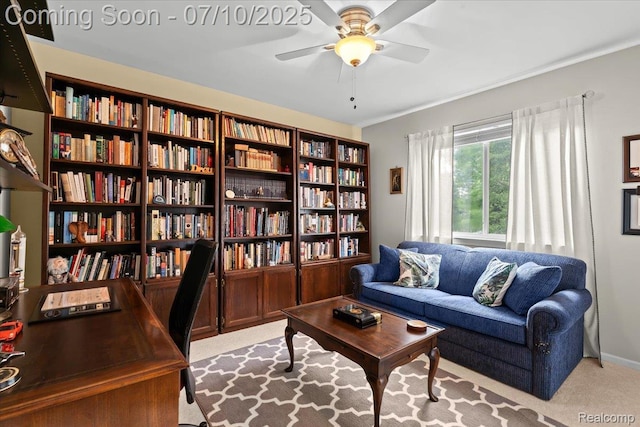 4583 Racewood Dr, Commerce Twp, MI 48382 - living area featuring light carpet, bookshelves, and ceiling fan