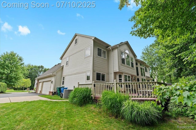 4583 Racewood Dr, Commerce Twp, MI 48382 - view of side of home with a lawn, a wooden deck, and driveway
