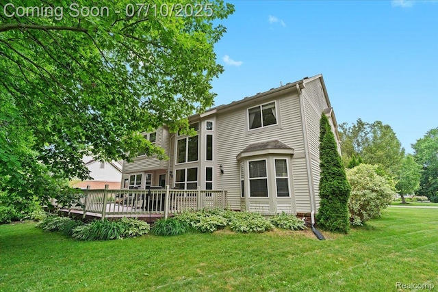 4583 Racewood Dr, Commerce Twp, MI 48382 - back of house with a wooden deck and a yard