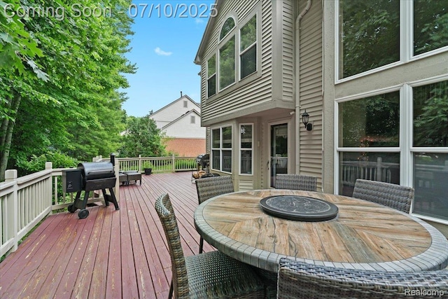 4583 Racewood Dr, Commerce Twp, MI 48382 - wooden terrace with outdoor dining space and a grill