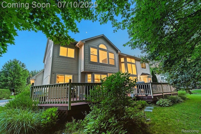 4583 Racewood Dr, Commerce Twp, MI 48382 - back of property with a wooden deck and a lawn