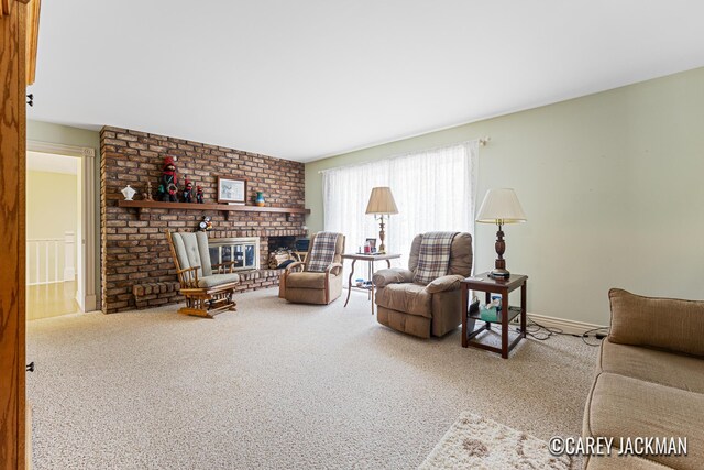 3910 Walker Ave NW, Grand Rapids, MI 49544 - carpeted living room with a fireplace