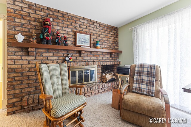 3910 Walker Ave NW, Grand Rapids, MI 49544 - living area with carpet floors and a brick fireplace