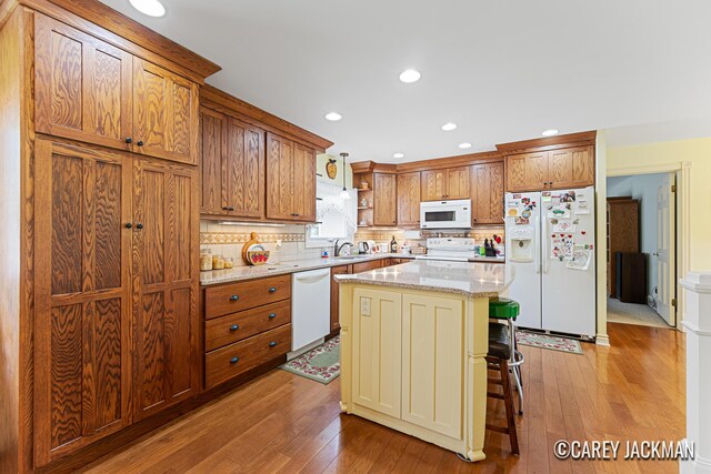 3910 Walker Ave NW, Grand Rapids, MI 49544 - kitchen featuring white appliances, open shelves, hardwood / wood-style floors, decorative backsplash, and recessed lighting