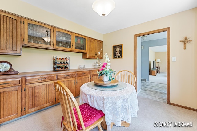 3910 Walker Ave NW, Grand Rapids, MI 49544 - dining room featuring light carpet and baseboards