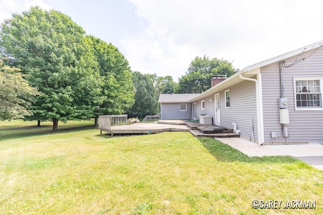 3910 Walker Ave NW, Grand Rapids, MI 49544 - view of grassy yard featuring a wooden deck