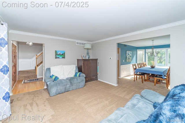 3830 Kossuth Rd, Lake Orion, MI 48360 - carpeted living area with crown molding, stairs, a chandelier, and wainscoting