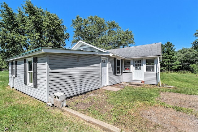1982 Mckinley St, Kalamazoo, MI 49004 - view of front of property featuring a front lawn and a shingled roof