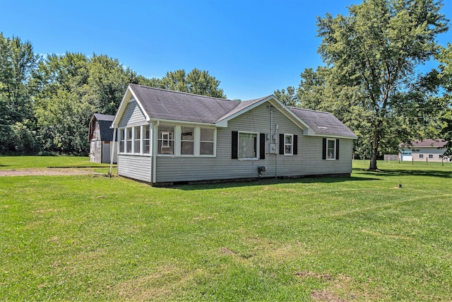 1982 Mckinley St, Kalamazoo, MI 49004 - ranch-style home with a front lawn and a shingled roof