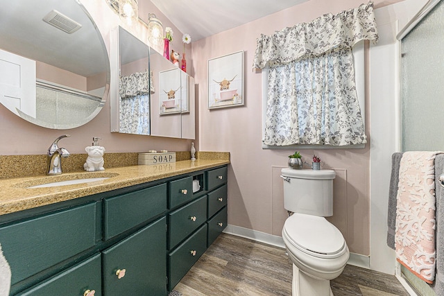 526 N 28th St, Kalamazoo, MI 49048 - full bathroom with wood finished floors, vanity, and a shower