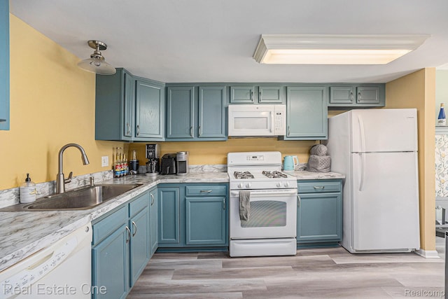 239 Fieldcrest St, Ann Arbor, MI 48103 - kitchen with white appliances, light countertops, light wood-style flooring, and blue cabinetry